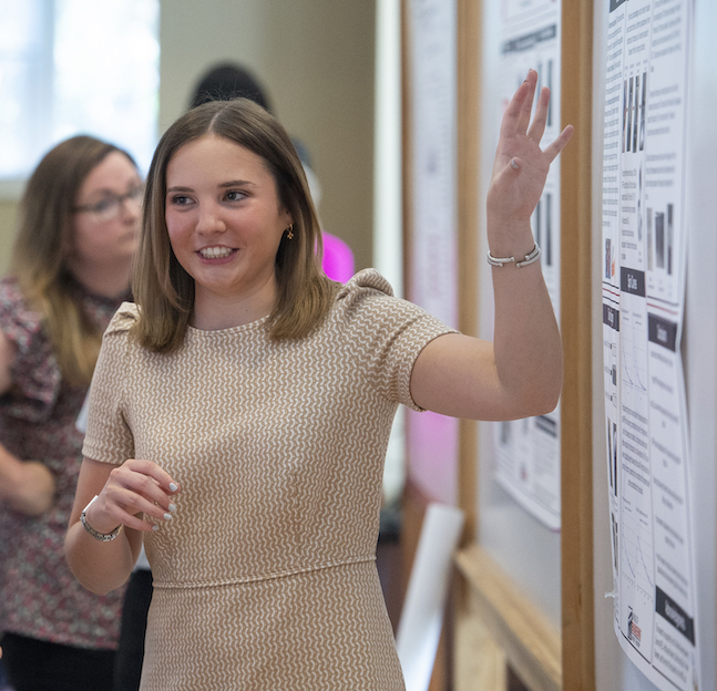 A biomedical engineering student gives a presentation at nano-reu.