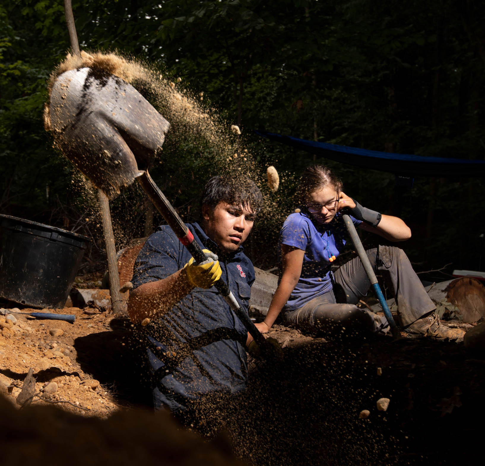 students digging in the earth