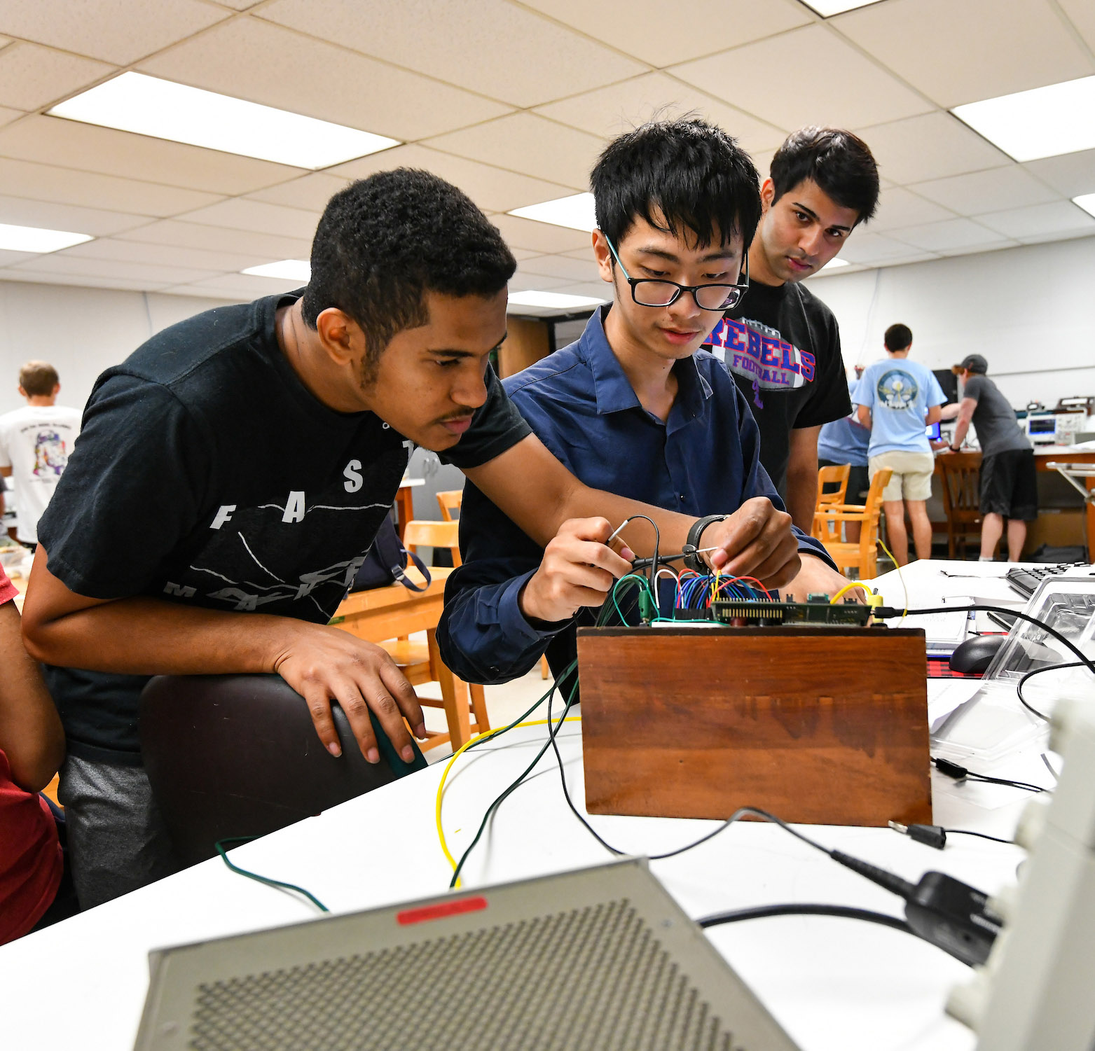 students working on electrical research