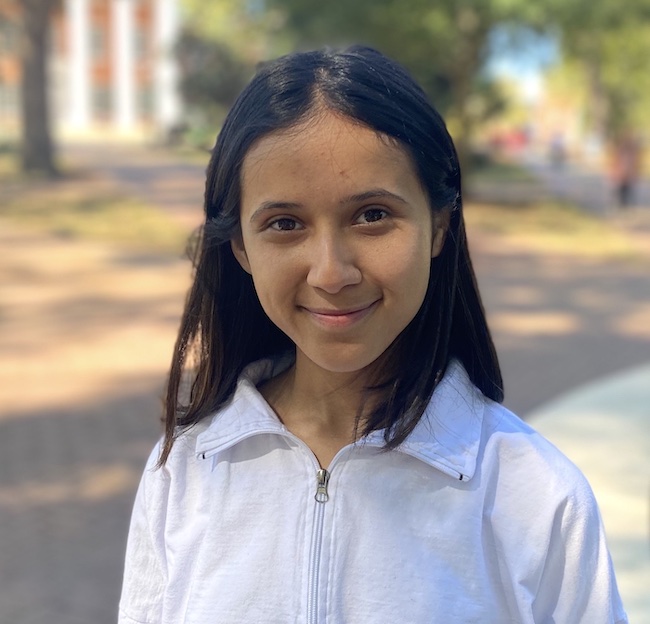 Computer science student, Amisha Subedi, poses for a photo in the circle.