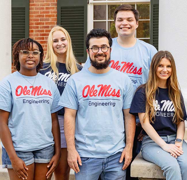 Ole Miss engineering students pose for a group photo in front of the Lyceum.