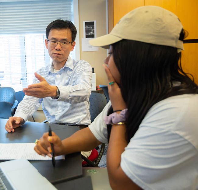 An Ole Miss computer science student works closely with one of her professors.