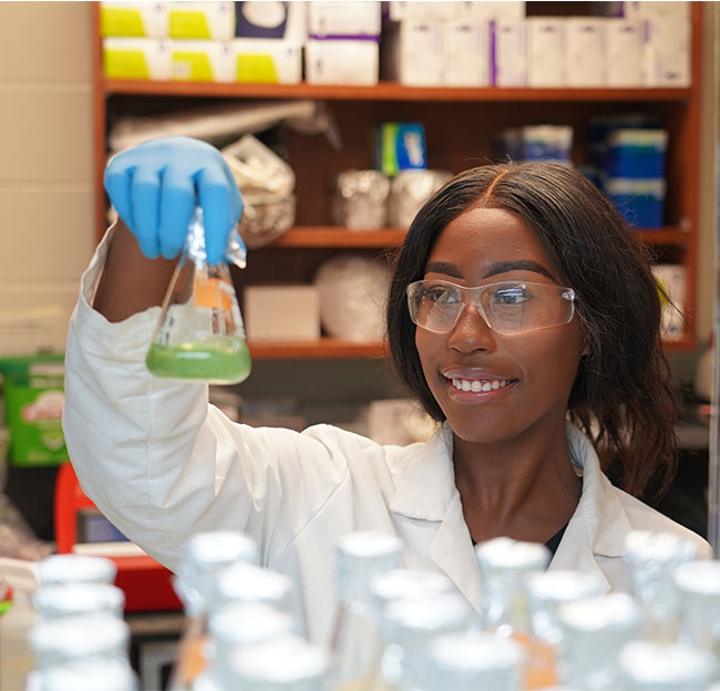 student observing bacteria