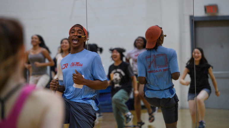 student leading a fitness class