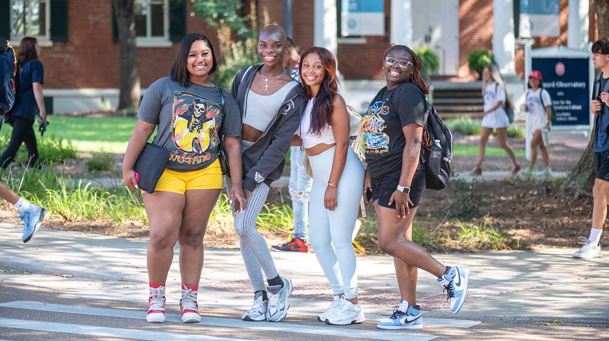 A group of students pose for a group photo in front of Barnard Observatory on the first day of fall classes.