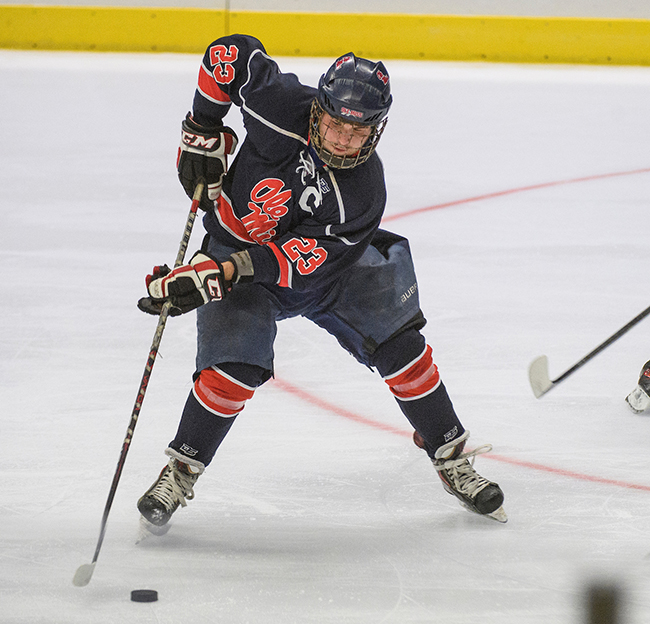 Ole miss hockey player dribbles a puck