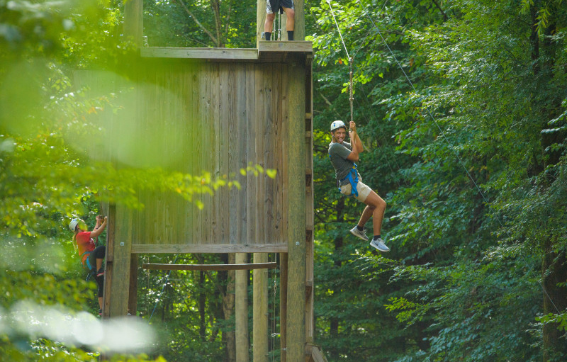 students climbing on wooden structures